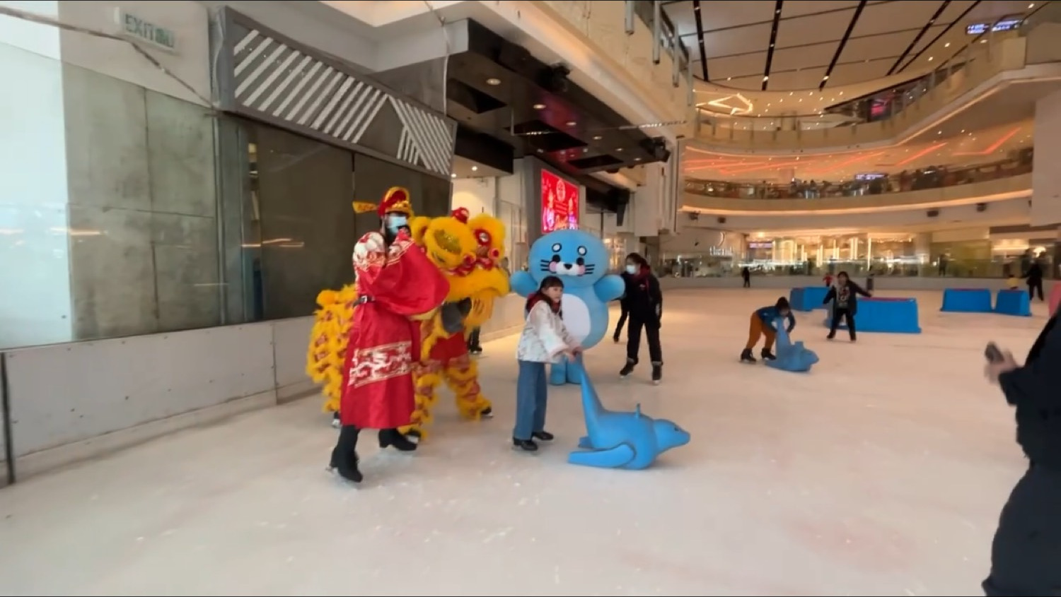 Mascot and lion dance on the ice